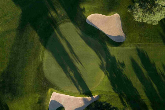aerial view of golf green with bunkers and sand